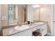 Bathroom featuring double sinks, granite countertops, a vanity area, and decorative fixtures at 226 Euharlee Five Forks Rd, Kingston, GA 30145