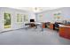 Spacious office featuring natural light, neutral walls, ceiling fan, and multiple work spaces at 226 Euharlee Five Forks Rd, Kingston, GA 30145