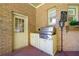 Outdoor kitchen with a built-in grill, sink, and storage space on the covered patio at 226 Euharlee Five Forks Rd, Kingston, GA 30145