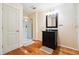 Well-lit bathroom featuring a shower with glass door and a black vanity cabinet at 325 Stonecastle Sw Pass, Atlanta, GA 30331