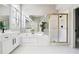 Bathroom featuring a glass enclosed shower, soaking tub with tiled surround, and a double sink vanity at 325 Stonecastle Sw Pass, Atlanta, GA 30331