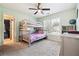 Comfortable bedroom with a bunk bed, soft carpet, and a bright window at 325 Stonecastle Sw Pass, Atlanta, GA 30331