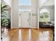 Inviting two-story foyer boasts hardwood floors and lots of natural light; access to living room and dining room at 325 Stonecastle Sw Pass, Atlanta, GA 30331
