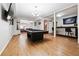 Spacious game room with a pool table, bar, wood floors, and recessed lighting, perfect for entertainment at 325 Stonecastle Sw Pass, Atlanta, GA 30331
