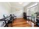 Well-lit home office offers hardwood floors, large windows, and a functional layout for productivity at 325 Stonecastle Sw Pass, Atlanta, GA 30331