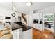 Modern kitchen with black counters, stainless steel appliances, island, and bright pendant lighting at 325 Stonecastle Sw Pass, Atlanta, GA 30331