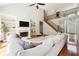 Spacious living room with high ceilings, fireplace, built-ins, and hardwood floors at 325 Stonecastle Sw Pass, Atlanta, GA 30331