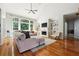 Bright living room with fireplace, built-in shelving, hardwood floors, and vaulted ceiling at 325 Stonecastle Sw Pass, Atlanta, GA 30331