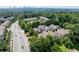 An aerial view of the townhomes near commercial, highlighting accessibility to the city at 196 Mystic Ct, Atlanta, GA 30342
