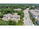 An aerial view of the townhomes, highlighting their proximity to a main road and local apartments at 196 Mystic Ct, Atlanta, GA 30342