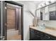 Well-lit bathroom featuring a glass bowl sink, granite countertop, and a shower with a curtain at 196 Mystic Ct, Atlanta, GA 30342
