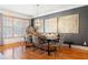 Modern dining room with hardwood floors, natural light, and a sophisticated chandelier at 196 Mystic Ct, Atlanta, GA 30342