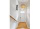 Bright entryway with hardwood floors, statement lighting, wallpaper, and classic staircase at 196 Mystic Ct, Atlanta, GA 30342