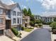 Charming townhome with a manicured lawn, stone accents, and an attached garage at 196 Mystic Ct, Atlanta, GA 30342