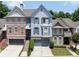 Charming townhome with a well-manicured front yard, neutral palette, and covered front porch at 196 Mystic Ct, Atlanta, GA 30342