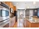 Spacious kitchen features stainless appliances, a large island, and a breakfast nook with plenty of natural light at 196 Mystic Ct, Atlanta, GA 30342