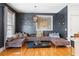 Stylish living room with hardwood floors, unique lighting, and a comfortable seating area perfect for relaxing or entertaining at 196 Mystic Ct, Atlanta, GA 30342