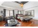 Bright main bedroom with hardwood floors, a sitting area, and a large window offering ample natural light at 196 Mystic Ct, Atlanta, GA 30342