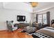Charming main bedroom with a seating area, hardwood floors, and a large window with plenty of natural light at 196 Mystic Ct, Atlanta, GA 30342
