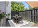 Charming patio featuring a dining table, chairs, and a well-maintained garden at 196 Mystic Ct, Atlanta, GA 30342