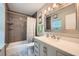 Nicely tiled bathroom features an extended vanity, and shower with tub at 3440 Ashwood Ln, Atlanta, GA 30341