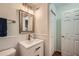 Bathroom featuring a single sink vanity, a framed mirror, and shower and toilet at 3440 Ashwood Ln, Atlanta, GA 30341
