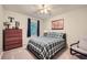 Bedroom featuring a bed, a wood dresser, a chair and artwork at 3440 Ashwood Ln, Atlanta, GA 30341