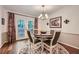 Cozy dining area with hardwood floors, natural light, and access to the backyard at 3440 Ashwood Ln, Atlanta, GA 30341