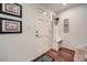 Bright entryway with hardwood floors, a white front door, coat rack, and decorative wall art at 3440 Ashwood Ln, Atlanta, GA 30341