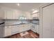 Well-lit kitchen features white cabinetry, modern appliances, and beautiful backsplash at 3440 Ashwood Ln, Atlanta, GA 30341