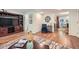Open living room with hardwood floors, a mounted TV, and seamless transitions to dining space at 3440 Ashwood Ln, Atlanta, GA 30341