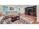 Spacious living room with hardwood floors, neutral sofa, TV console, and views to other rooms at 3440 Ashwood Ln, Atlanta, GA 30341