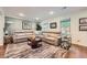 Inviting living room with hardwood floors, neutral sofa, and natural light from the windows at 3440 Ashwood Ln, Atlanta, GA 30341