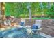 Outdoor patio featuring seating and a beautiful green backdrop at 3440 Ashwood Ln, Atlanta, GA 30341
