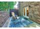 Cozy outdoor patio with beautiful pavers, comfortable seating, and lush greenery at 3440 Ashwood Ln, Atlanta, GA 30341