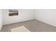 This bedroom is carpeted and features a window for natural light at 4447 Manor Hill Dr, Union City, GA 30291