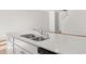 Elegant kitchen island with stainless steel sink, faucet and modern appliances at 4447 Manor Hill Dr, Union City, GA 30291