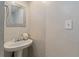 Charming half bathroom with pedestal sink, decorative mirror, and clean design elements at 836 Saint Charles Ne Ave # I, Atlanta, GA 30306