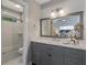 Bathroom with a large vanity, modern lighting, and a separate shower/tub area at 836 Saint Charles Ne Ave # I, Atlanta, GA 30306