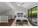 Light-filled bedroom with vaulted ceiling, balcony access, and stylish decor at 836 Saint Charles Ne Ave # I, Atlanta, GA 30306
