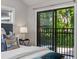 Bedroom Balcony offering private outdoor access with a view of lush, mature greenery at 836 Saint Charles Ne Ave # I, Atlanta, GA 30306