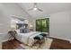 Bright bedroom featuring a balcony, vaulted ceiling, and hardwood floors, creating a cozy retreat at 836 Saint Charles Ne Ave # I, Atlanta, GA 30306