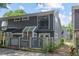 Charming exterior view of townhomes, showcasing modern design with gray siding, balconies, and well-maintained landscaping at 836 Saint Charles Ne Ave # I, Atlanta, GA 30306