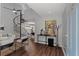 Stylish foyer with a distinctive spiral staircase, sleek console table, and contemporary artwork at 836 Saint Charles Ne Ave # I, Atlanta, GA 30306