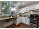 Efficient kitchenette with stainless steel appliances, granite countertops, and bright natural light at 836 Saint Charles Ne Ave # I, Atlanta, GA 30306