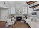 Bright living room features a cozy fireplace, built-in shelves, and elegant décor with comfortable seating at 836 Saint Charles Ne Ave # I, Atlanta, GA 30306