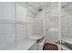 Spacious walk-in closet with built-in shelves and hanging rods offers ample storage space and organization options at 836 Saint Charles Ne Ave # I, Atlanta, GA 30306