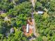 An aerial view of a wooded property featuring a mobile home, additional building and mature trees at 4820 Scott Rd, Cumming, GA 30041