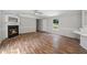 Inviting living room featuring hardwood floors, a charming fireplace, and ample natural light at 4820 Scott Rd, Cumming, GA 30041