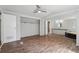 Bedroom with ceiling fan, ensuite, and wood-look flooring and spacious layout at 4820 Scott Rd, Cumming, GA 30041